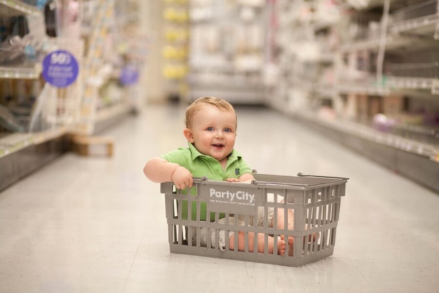baby in a shopping basket