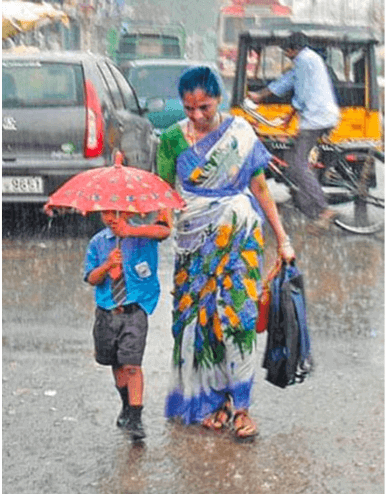 Mom taking her kid to school in the rain holding her hand