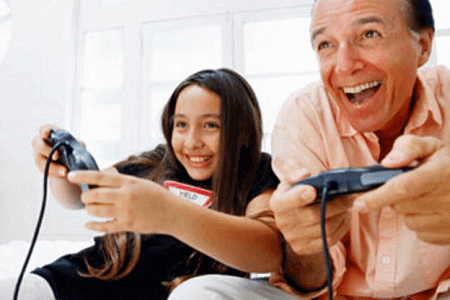 Image of father and girl playing video game